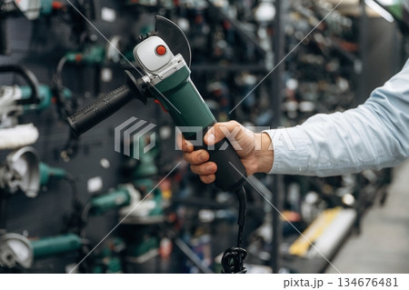 Detailed close up view of man's hand in the hardware store 134676481