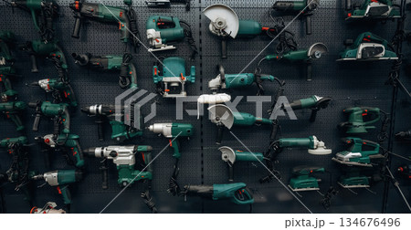 Bunch of circular saws on the wall in the hardware store 134676496