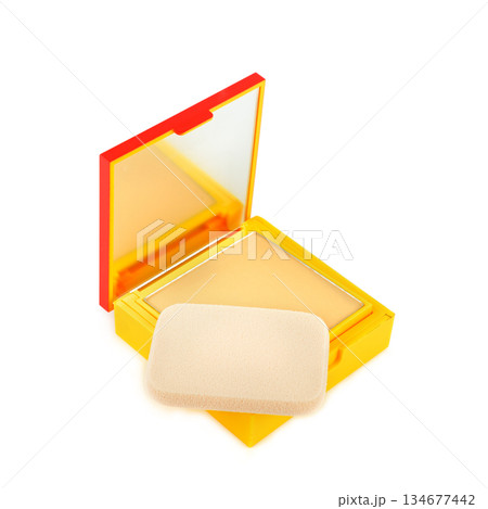 Open compact face powder with sponge applicator isolated on white background. Open compact face powder with sponge applicator isolated on white background. 134677442