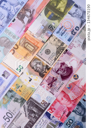 Paper money, banknotes of different countries as a business background. Paper money and cash Paper money, banknotes of different countries as a business background. Paper money and cash 134678190