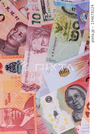 Paper money, banknotes of different countries as a business background. Paper money and cash Paper money, banknotes of different countries as a business background. Paper money and cash 134678224