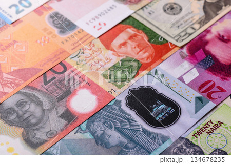 Paper money, banknotes of different countries as a business background. Paper money and cash Paper money, banknotes of different countries as a business background. Paper money and cash 134678235