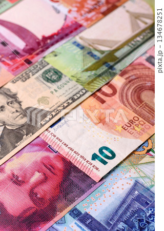 Paper money, banknotes of different countries as a business background. Paper money and cash Paper money, banknotes of different countries as a business background. Paper money and cash 134678251