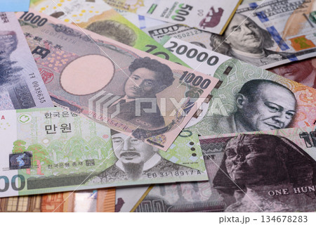 Paper money, banknotes of different countries as a business background. Paper money and cash 134678283