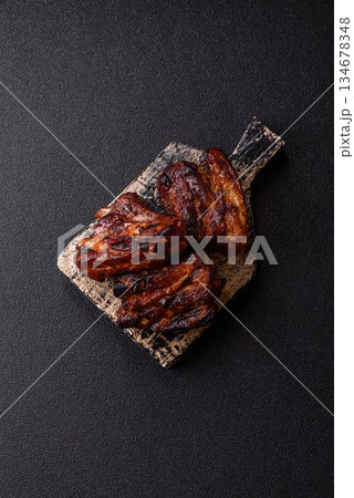 Grilled or barbecued pork ribs with sauce. Grilled ribs Grilled or barbecued pork ribs with sauce. Grilled ribs 134678348