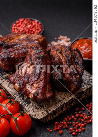 Grilled or barbecued pork ribs with sauce. Grilled ribs 134678362