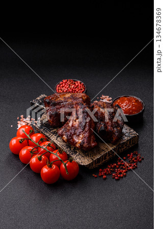 Grilled or barbecued pork ribs with sauce. Grilled ribs Grilled or barbecued pork ribs with sauce. Grilled ribs 134678369
