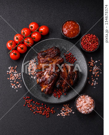 Grilled or barbecued pork ribs with sauce. Grilled ribs Grilled or barbecued pork ribs with sauce. Grilled ribs 134678374