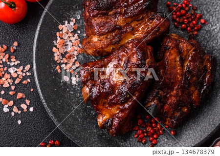 Grilled or barbecued pork ribs with sauce. Grilled ribs Grilled or barbecued pork ribs with sauce. Grilled ribs 134678379