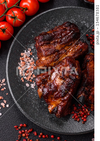 Grilled or barbecued pork ribs with sauce. Grilled ribs 134678381