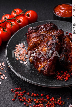 Grilled or barbecued pork ribs with sauce. Grilled ribs 134678382