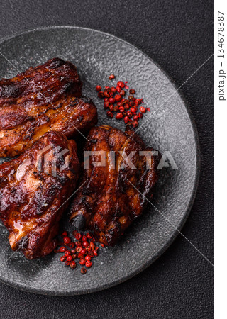 Grilled or barbecued pork ribs with sauce. Grilled ribs Grilled or barbecued pork ribs with sauce. Grilled ribs 134678387