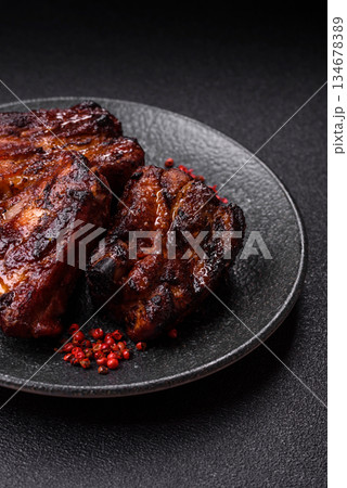 Grilled or barbecued pork ribs with sauce. Grilled ribs Grilled or barbecued pork ribs with sauce. Grilled ribs 134678389