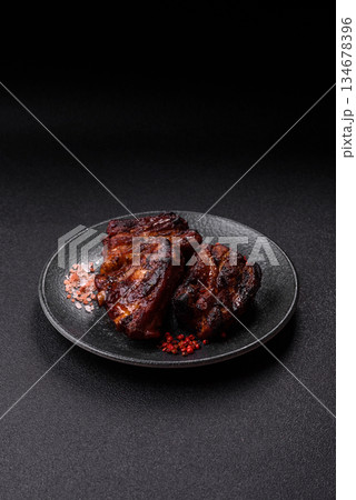 Grilled or barbecued pork ribs with sauce. Grilled ribs Grilled or barbecued pork ribs with sauce. Grilled ribs 134678396
