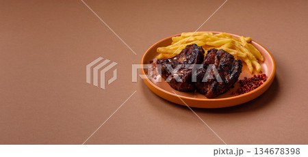 Grilled or barbecued pork ribs with sauce. Grilled ribs Grilled or barbecued pork ribs with sauce. Grilled ribs 134678398