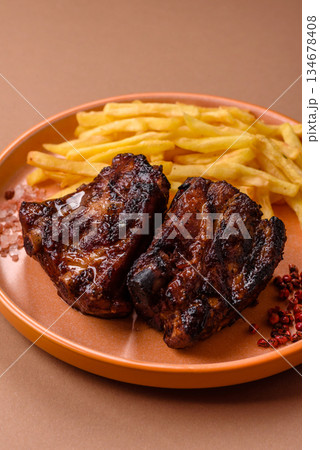 Grilled or barbecued pork ribs with sauce. Grilled ribs Grilled or barbecued pork ribs with sauce. Grilled ribs 134678408