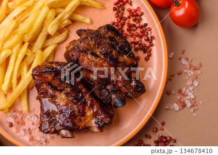 Grilled or barbecued pork ribs with sauce. Grilled ribs Grilled or barbecued pork ribs with sauce. Grilled ribs 134678410