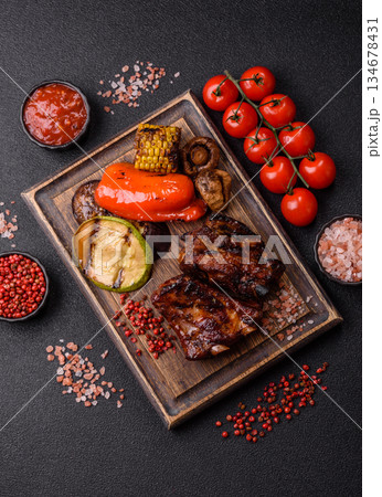 Grilled or barbecued pork ribs with sauce. Grilled ribs Grilled or barbecued pork ribs with sauce. Grilled ribs 134678431