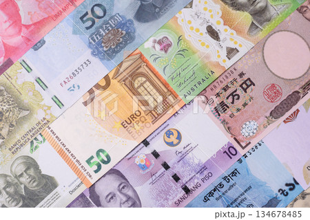 Paper money, banknotes of different countries as a business background. Paper money and cash Paper money, banknotes of different countries as a business background. Paper money and cash 134678485
