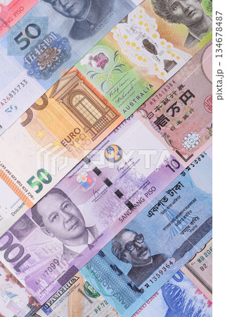 Paper money, banknotes of different countries as a business background. Paper money and cash Paper money, banknotes of different countries as a business background. Paper money and cash 134678487