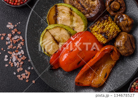 Grilled vegetables, bell peppers, mushrooms, and zucchini, a vegetarian meal. Grilled vegetables Grilled vegetables, bell peppers, mushrooms, and zucchini, a vegetarian meal. Grilled vegetables 134678527