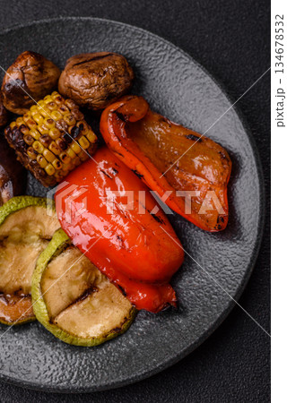 Grilled vegetables, bell peppers, mushrooms, and zucchini, a vegetarian meal. Grilled vegetables Grilled vegetables, bell peppers, mushrooms, and zucchini, a vegetarian meal. Grilled vegetables 134678532