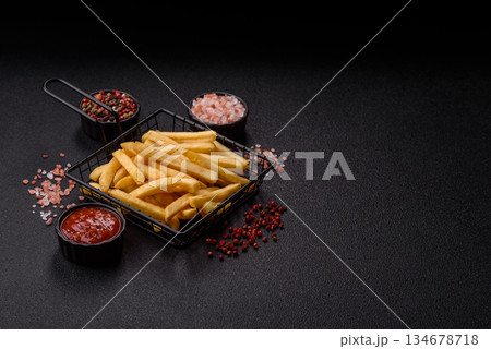 French fries are salty, crispy, and fried in oil, unhealthy takeaway food. French fries French fries are salty, crispy, and fried in oil, unhealthy takeaway food. French fries 134678718