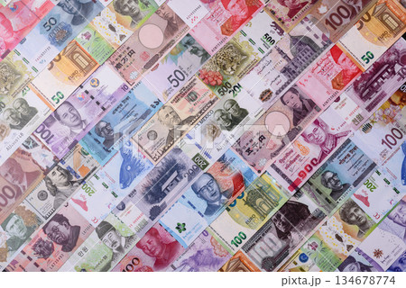 Paper money, banknotes of different countries as a business background. Paper money and cash Paper money, banknotes of different countries as a business background. Paper money and cash 134678774