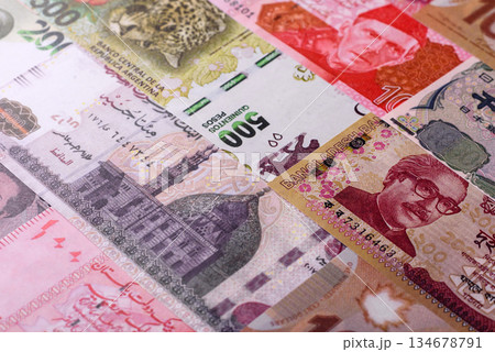 Paper money, banknotes of different countries as a business background. Paper money and cash Paper money, banknotes of different countries as a business background. Paper money and cash 134678791