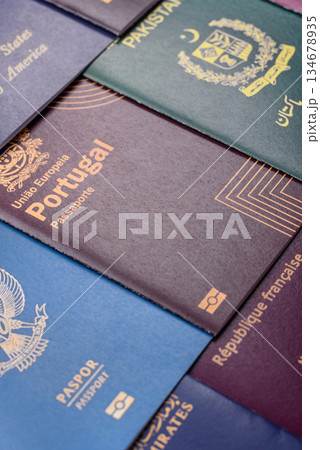 A background of several passports from different countries, an international ID card. Passport 134678935