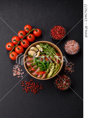 Seared tuna tataki in a bowl with sesame seeds, rice, and vegetables. Tuna tataki Seared tuna tataki in a bowl with sesame seeds, rice, and vegetables. Tuna tataki 134679277