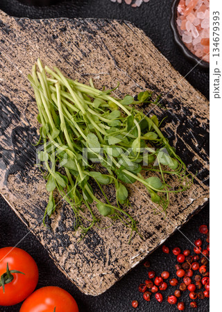 Fresh green sprouts of pea microgreens for a healthy detox meal. Sprout pea microgreens Fresh green sprouts of pea microgreens for a healthy detox meal. Sprout pea microgreens 134679393