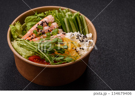 A prawn or shrimp bowl with rice, tomatoes, sauce, and vegetables, Asian food. Prawn or shrimp 134679406