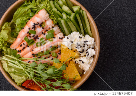 A prawn or shrimp bowl with rice, tomatoes, sauce, and vegetables, Asian food. Prawn or shrimp A prawn or shrimp bowl with rice, tomatoes, sauce, and vegetables, Asian food. Prawn or shrimp 134679407