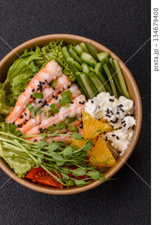 A prawn or shrimp bowl with rice, tomatoes, sauce, and vegetables, Asian food. Prawn or shrimp 134679408