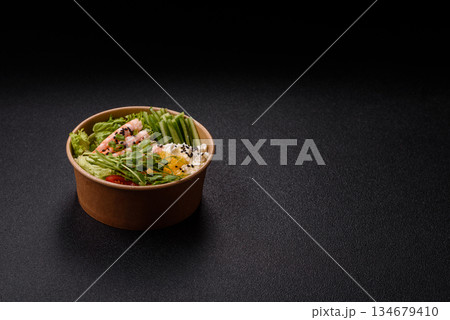 A prawn or shrimp bowl with rice, tomatoes, sauce, and vegetables, Asian food. Prawn or shrimp A prawn or shrimp bowl with rice, tomatoes, sauce, and vegetables, Asian food. Prawn or shrimp 134679410