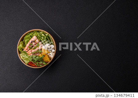 A prawn or shrimp bowl with rice, tomatoes, sauce, and vegetables, Asian food. Prawn or shrimp A prawn or shrimp bowl with rice, tomatoes, sauce, and vegetables, Asian food. Prawn or shrimp 134679411