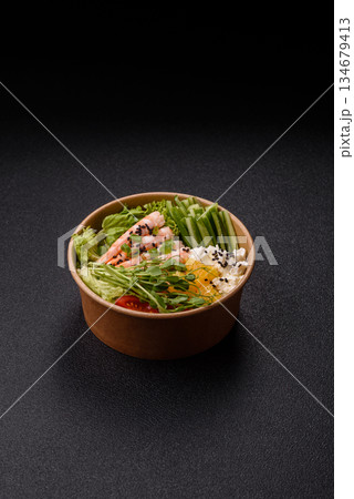 A prawn or shrimp bowl with rice, tomatoes, sauce, and vegetables, Asian food. Prawn or shrimp 134679413