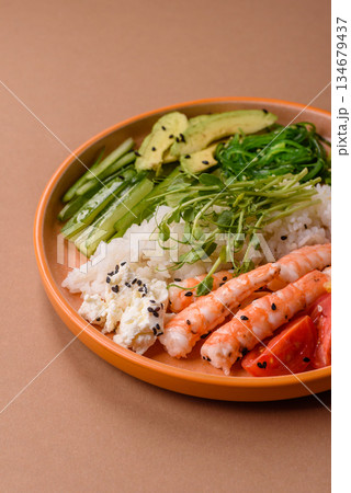 A prawn or shrimp bowl with rice, tomatoes, sauce, and vegetables, Asian food. Prawn or shrimp 134679437