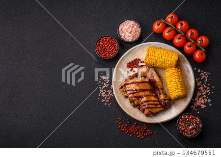 Grilled boneless chicken legs baked on the barbecue for lunch. Grilled chicken as a background Grilled boneless chicken legs baked on the barbecue for lunch. Grilled chicken as a background 134679551