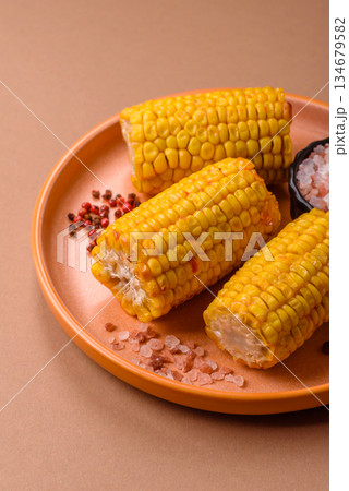 Corn cob cooked in chunks, vegetables, healthy vegetarian food. Boiled corn as a background Corn cob cooked in chunks, vegetables, healthy vegetarian food. Boiled corn as a background 134679582