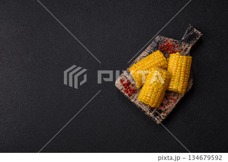 Corn cob cooked in chunks, vegetables, healthy vegetarian food. Boiled corn as a background 134679592