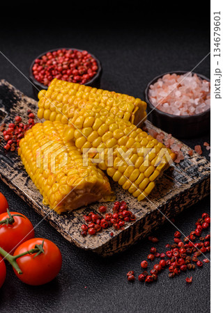 Corn cob cooked in chunks, vegetables, healthy vegetarian food. Boiled corn as a background Corn cob cooked in chunks, vegetables, healthy vegetarian food. Boiled corn as a background 134679601