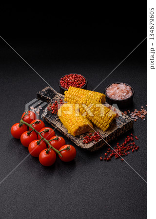 Corn cob cooked in chunks, vegetables, healthy vegetarian food. Boiled corn as a background Corn cob cooked in chunks, vegetables, healthy vegetarian food. Boiled corn as a background 134679605