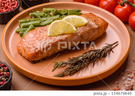 Fish, grilled salmon fillet, healthy food, seafood. Grilled salmon fillet as a background Fish, grilled salmon fillet, healthy food, seafood. Grilled salmon fillet as a background 134679640