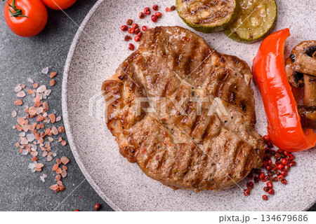 Grilled beef or pork steak, healthy restaurant food for lunch. Barbecue steak as a background 134679686