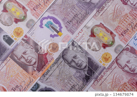 Britain paper money, pound sterling, cash banknotes for financial transactions. Britain money 134679874