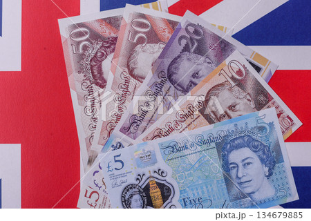Britain paper money, pound sterling, cash banknotes for financial transactions. Britain money 134679885