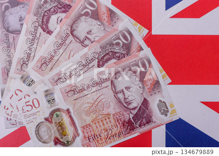 Britain paper money, pound sterling, cash banknotes for financial transactions. Britain money 134679889