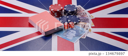 Casino game in the Great Britain, pound sterling money, chips, cards. Gambling in the England Casino game in the Great Britain, pound sterling money, chips, cards. Gambling in the England 134679897